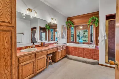 a large bathroom with two sinks and a tub and a shower at Talmont Pines 4BR Retreat with HOA Beach Access in Tahoe City