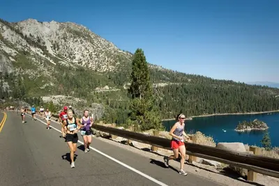 a group of people running down a road at One BDR at Northstar Walk to Village in Truckee