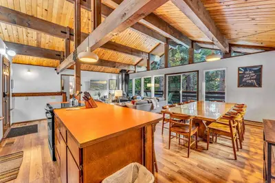 a kitchen and dining room with a table and chairs at Carnelian Bay Retreat with Deck & Bonus Room in Carnelian Bay