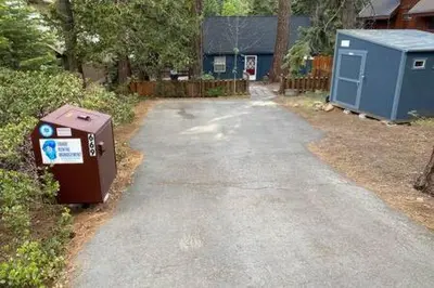 a driveway with a utility box on the side of a house at Mt Airy Cottage Walk to Beach in Tahoe Vista