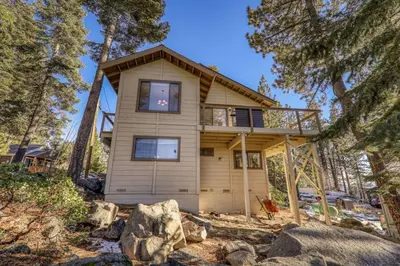 a house in the middle of a forest at Tahoe Vista Retreat with Lake View Walk to beach in Tahoe Vista