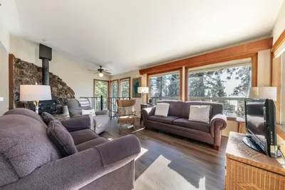 a living room with two couches and a television at Tahoe Vista Retreat with Lake View Walk to beach in Tahoe Vista