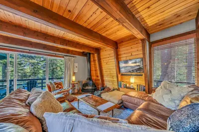 a living room with a couch and a table at The Haus of Pine A Vintage Tahoe Cabin in Tahoe City