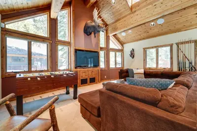 a large living room with a pool table at One Moose Lodge with Hot Tub in Tahoe Donner in Truckee