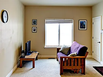 a living room with a couch and a window at Black Bear Cabin in South Lake Tahoe