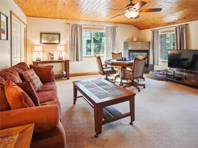 a living room with a couch and a table at High Sierra Escape - Cozy, Spacious Mountain Home in South Lake Tahoe