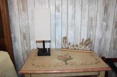 a table with a lamp on top of it at The Bonnie Inn Unit 1 in San Andreas