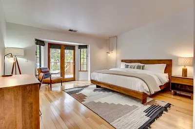 a white bedroom with a bed and a piano at Private Ski, Lake & Golf Chalet! Walk to Lake in Tahoe Vista