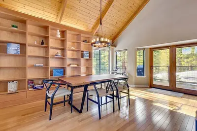 a dining room with a wooden table and chairs at Private Ski, Lake & Golf Chalet! Walk to Lake in Tahoe Vista