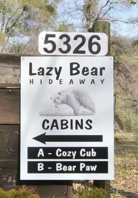 a sign for a zoo with a polar bear on it at Cozy Cub Cabin, brand new home near Yosemite in Mariposa