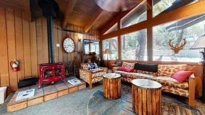 a living room with a couch and a stove at Mammoth Estates #225 condo in Mammoth Lakes