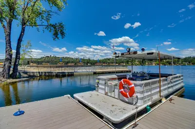 a boat is docked at a dock in the water at Big Creek Hideaway in Groveland