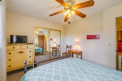 a bedroom with a bed and a ceiling fan at Serene Groveland Cabin Rental Near Yosemite! in Groveland