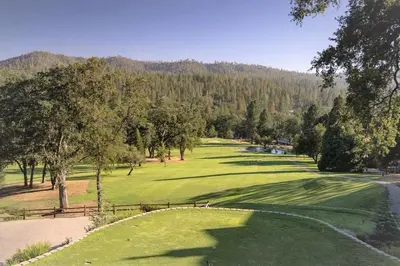 a view of a golf course with a green at The Nut House - Lovely Home with Hot Tub home in Groveland
