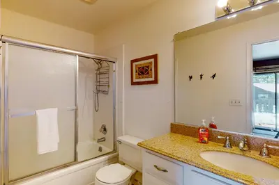 a bathroom with a sink and a shower and a toilet at Beaver Lodge in South Lake Tahoe