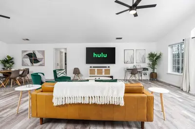 a living room with a couch and a tv at Country Club Hideout - w/ HotTub, King bed in Oakhurst