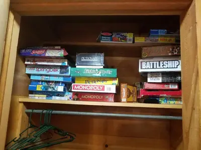 a book shelf filled with lots of books at Uncle Grizz's Cabin...get intouch with nature in Bass Lake Annex